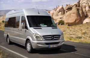 Silver Mercedes-Benz Sprinter passenger van